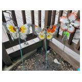Three metal and glass oudoor stake decorations,