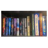 Contents of shelf w/ various books inc/ Easter