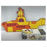 (IN) Yellow submarine toy and cardboard wall
