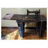 Antique White Sewing Machine in White Cabinet.