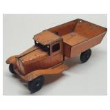 Vintage Wyandotte Dump Truck With Wood Wheels.