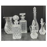 (P) Cut Glass Pitcher, Decanters, and Cruet Set.