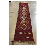(D) southwestern style rug measuring 145" by 33"