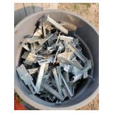 Garbage Can Full of Metal Hangimg Brakets
