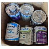 Box of PVC Pipe Cement, Cleaner, and Purple