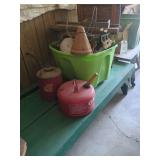 tote of vintage kitchen utensils, 2 gas cans, wooden green bench and TV tray table