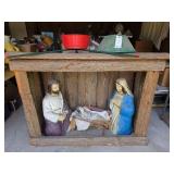 Nativity scene and Christmas tree stands