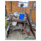 Steel workbench with vise and assorted steel