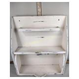 Metal shelving with primitive style canisters and