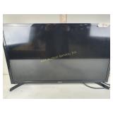 Samsung flat screen TV, with remote, powers on