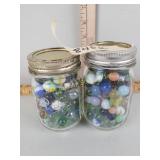 2 canning jars with marbles