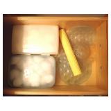 Cotton balls, adhesive tub treads, pill organizers