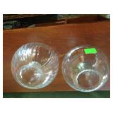 Glass candle holders, gardening magazines, and