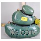 Ceramic "welcome" figurine