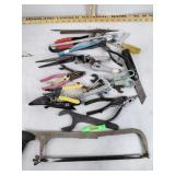 Handsaw, shears, wrenches, pliers