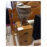 Metal file cabinet and bucket made into side