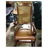 Wooden rocker with cane back