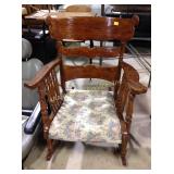 Wood chair with upholstered seat, appears to have