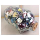 Glass pig jar full of matchbooks (local hotel/