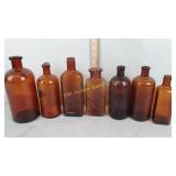 Vintage amber bottles including bottle marked