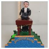 Reproduction cast iron mechanical bank - magician