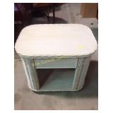 Wicker side table 22 inches tall by 26 inches