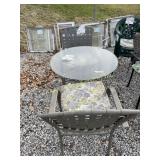 Glass top patio table and two chairs