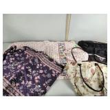 Vera Bradley and other garment bags. The pink