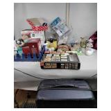 Suitcase, wire shower rack, figurines, motion