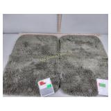 Two bathroom rugs light green 17 in by 24 in