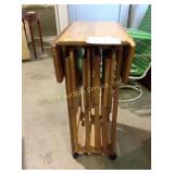 Drop leaf cart on casters with four TV trays