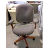 Upholstered and wood office chair on casters,