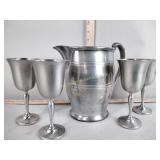Pewter cups and pitcher
