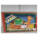 Illuminated camel, in original box, general foam