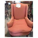 Upholstered arm chair, cushion is worn