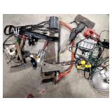 Saws, hammers, tape, lights, broken axe, and more