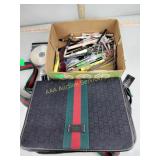 Purse, pens, pencils, wristwatch
