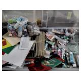 Craft supplies including paint brushes, glue,