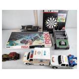Toys and games including tow truck, ambulance,