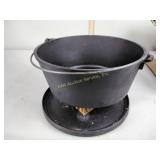 Lodge deep cast iron camp Dutch oven, appears to