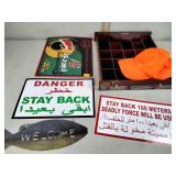 Shot glass shelf,  orange hat, metal signs