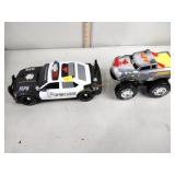 Toy police car and rhino monster truck