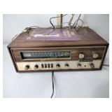 The Fisher AM FM stereo receiver, powers on