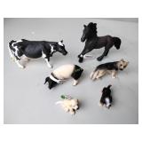 Schleich animal figures including Holstein cow,