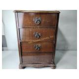 Cabinet with sewing notions and patterns