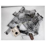 Metal railroad tracks, milk crate