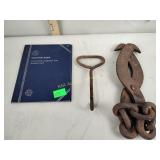 Lincoln cent book with a few coins, metal tongs