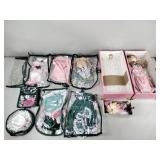 Doll in hard case with clothes, hat, blonde curly