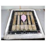 Framed stained glass window, missing some of the