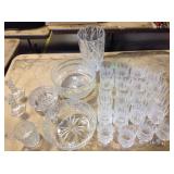 Clear glass pieces including bowls, candle